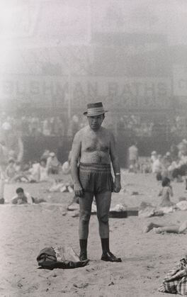 Man in hat, trunks, socks and shoes