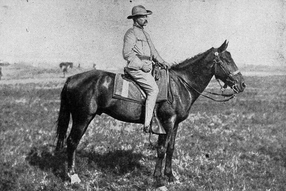 Teddy Roosevelt on horseback.
