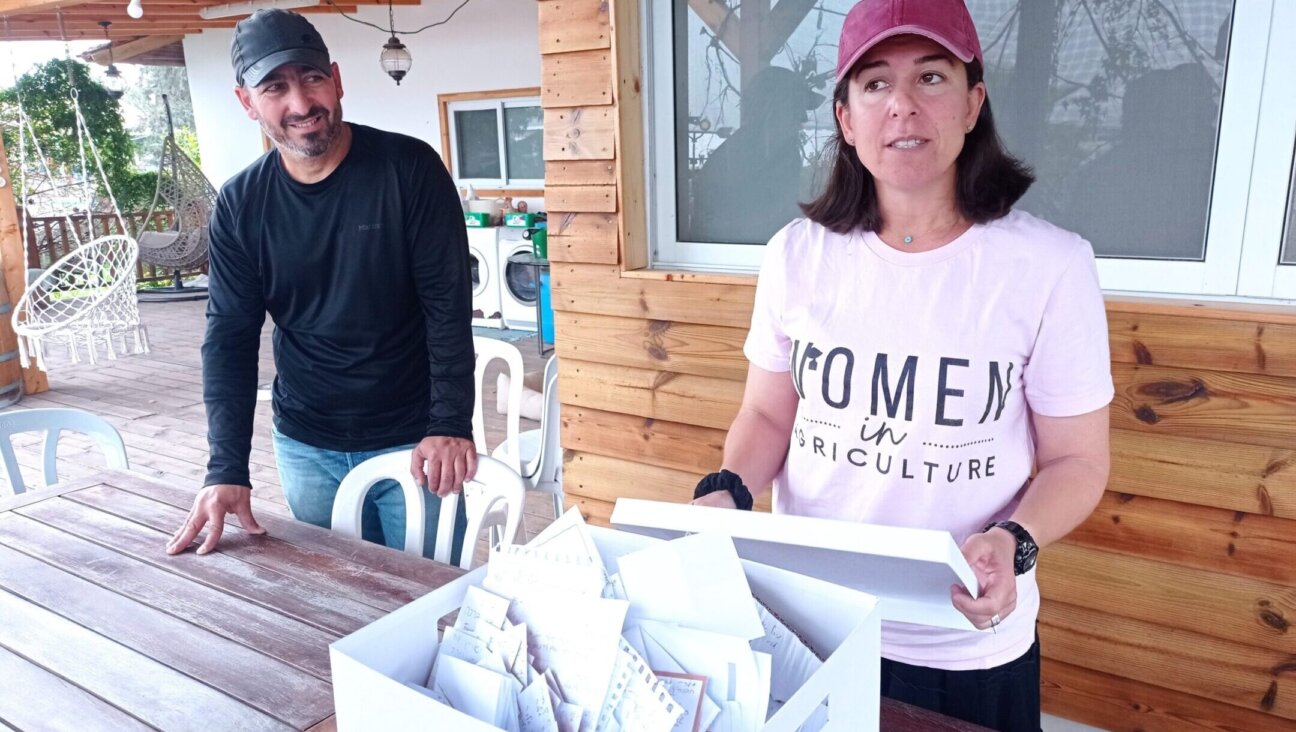 Ilana Toweg, right, and her husband Doron field countless prayer requests because of their prominence as Israel farmers strictly observing shmita, Jewish laws about letting farmland lie fallow every seven years. (Deborah Danan)