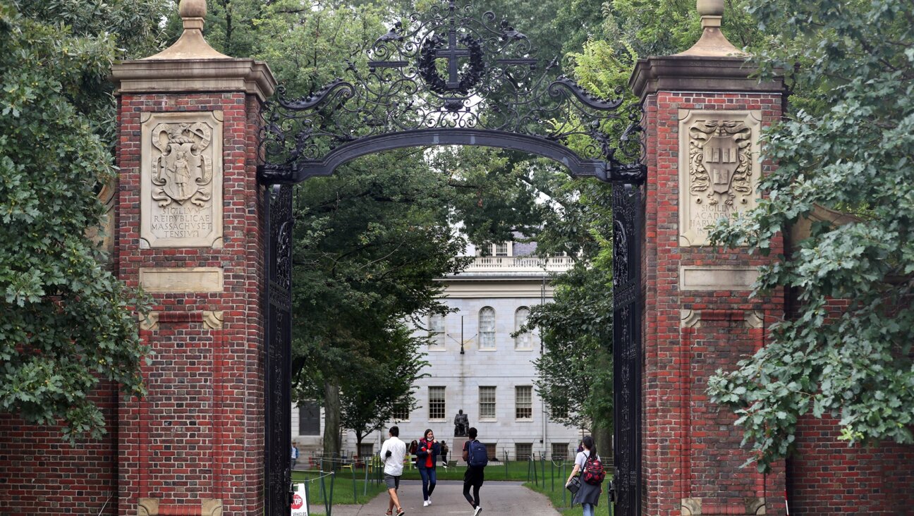 Students walk by the Harvard Yard gate in Cambridge, MA, Sep. 16, 2021. (David L. Ryan/The Boston Globe via Getty Images)