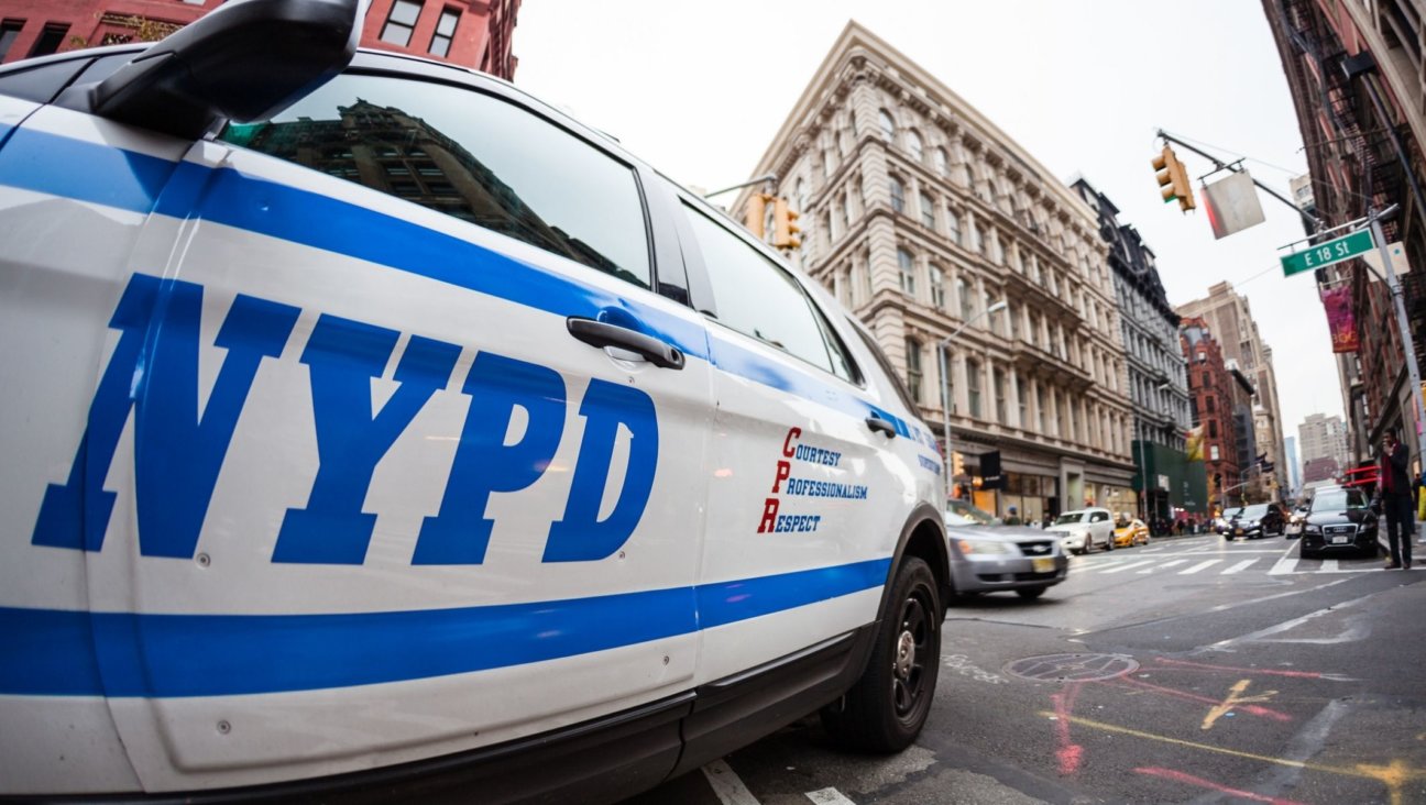 Close up of the NYPD logo on a police car. (Tim Drivas/Getty)