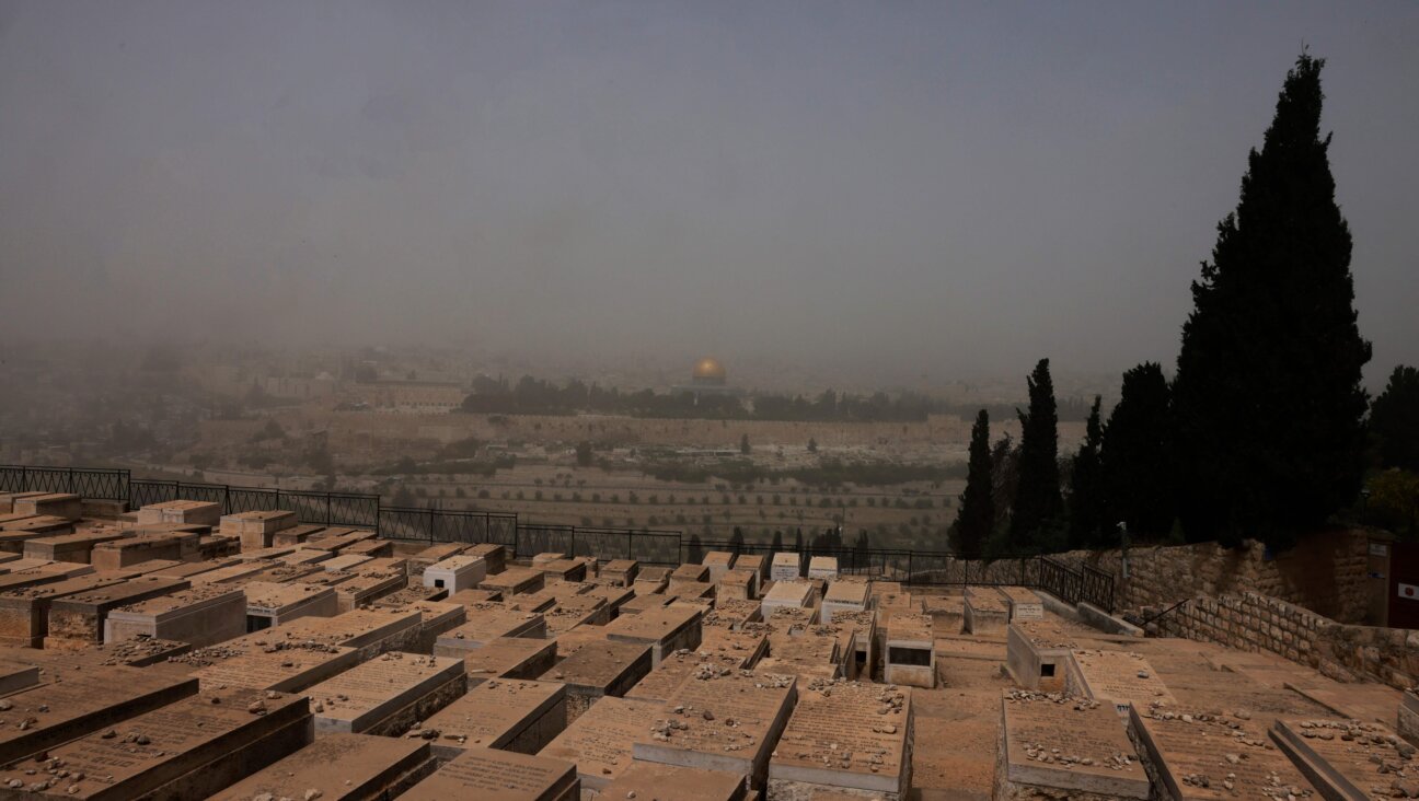 A view of Jerusalem's Old City, during a dust storm, from the Mount of Olives.