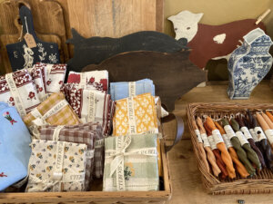 Gingham napkins, candles, and cutting boards on display at The Six Bells
