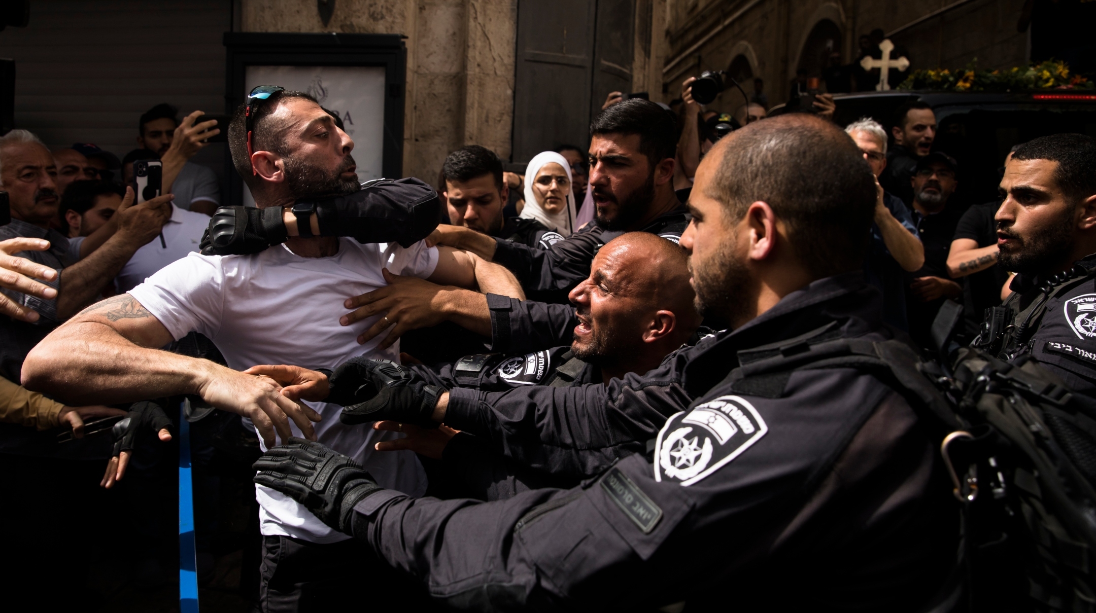 Police officers clash with attendees of the funeral of Al Jazeera reporter Shireen Abu Akleh in Jerusalem, May 12, 2022. 