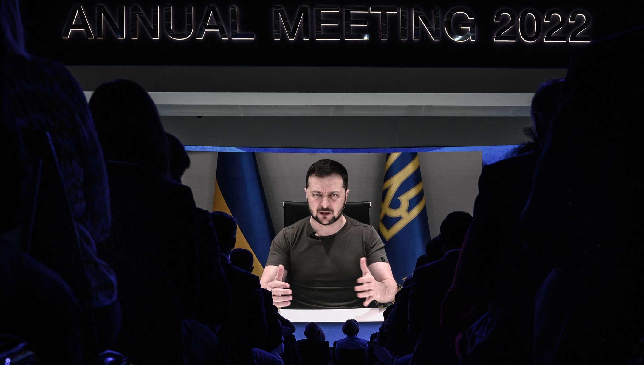 Ukraine President Volodymyr Zelensky appears on a giant screen during his address by video conference as part of the World Economic Forum (WEF) annual meeting in Davos, Switzerland, May 23, 2022. (Fabrice Coffrini/AFP via Getty Images)