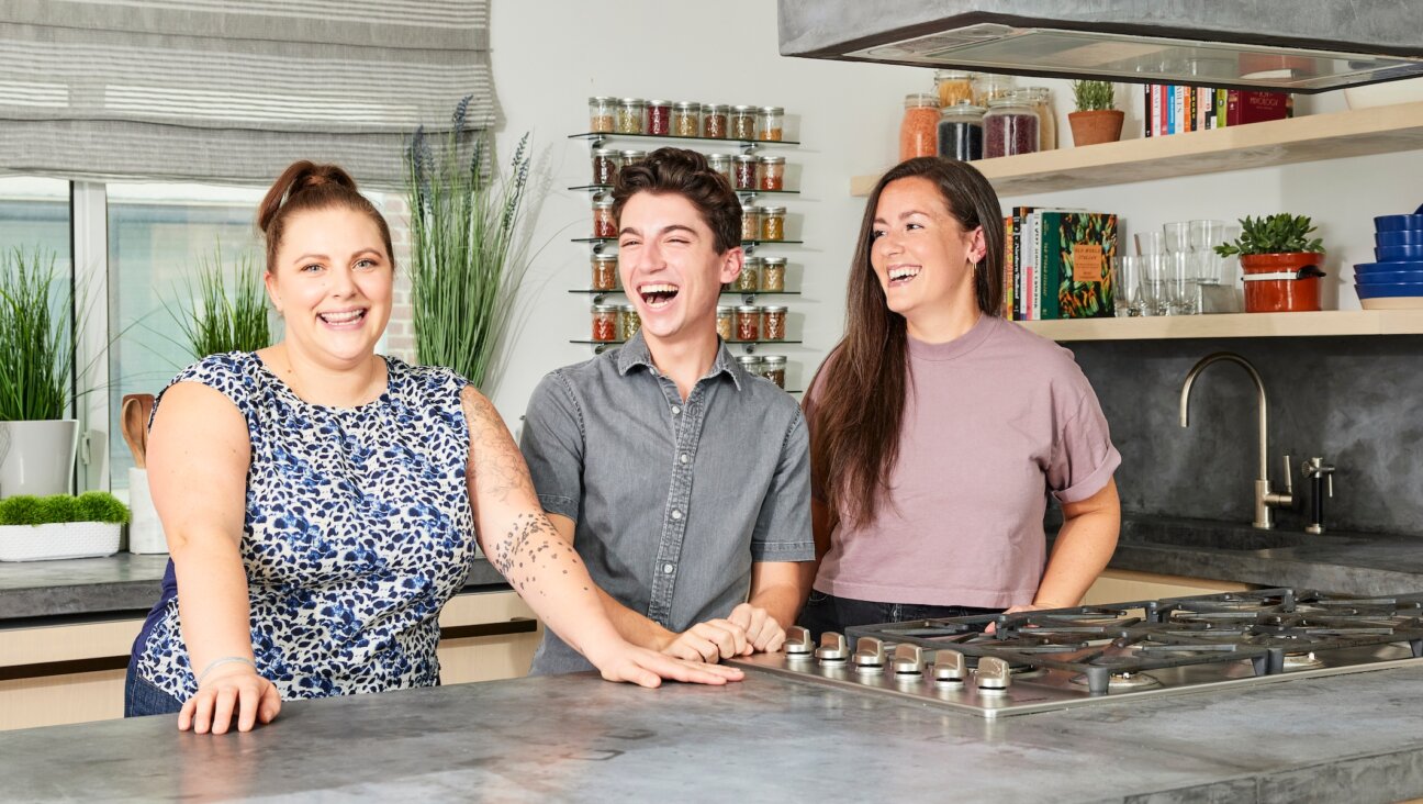 Eitan Bernath in his Manhattan test kitchen and apartment, with his culinary producers Rachel Dolfi, left, and Olivia Anderson. (Courtesy)