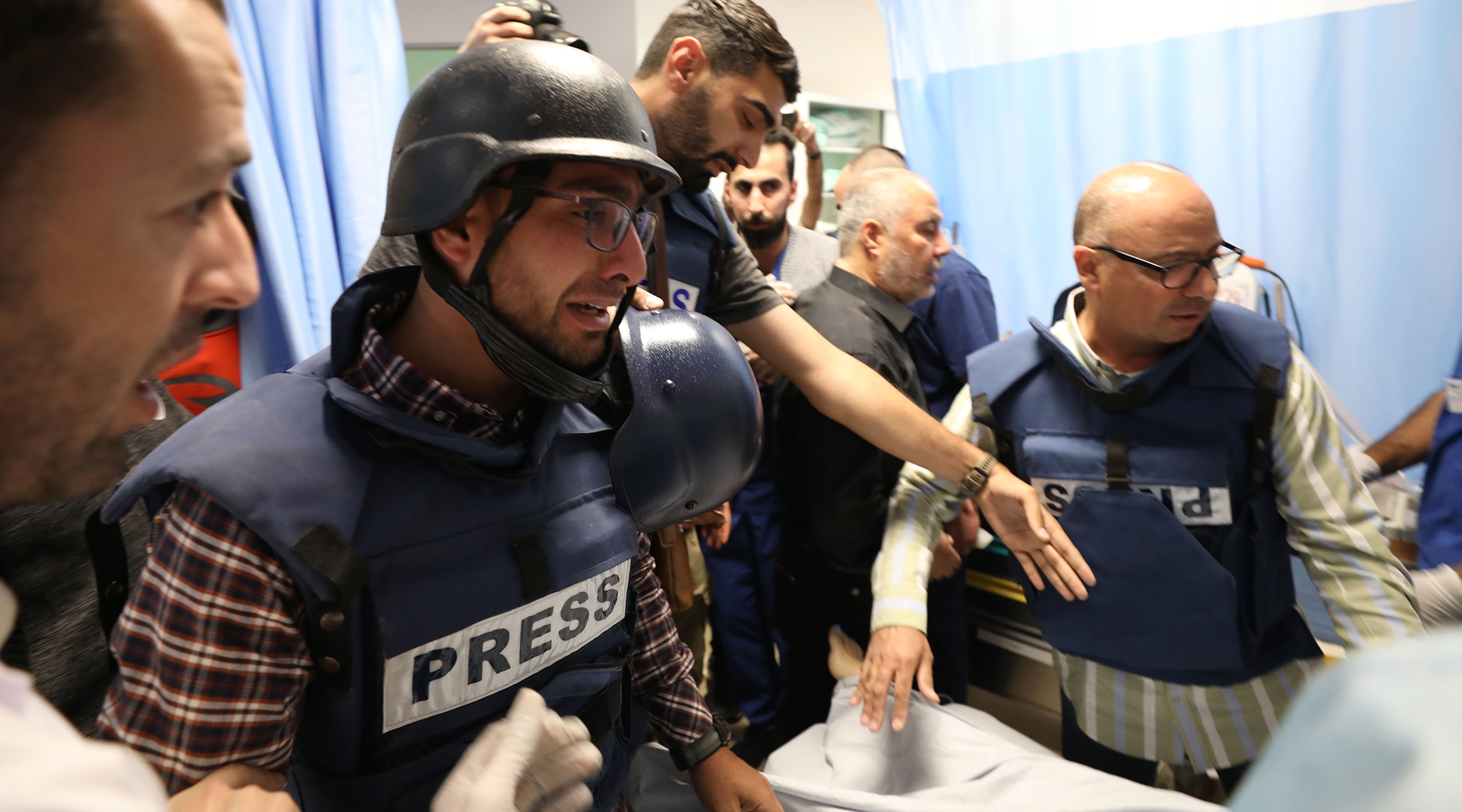 Journalists at a hospital in the West Bank city of Jenin mourn following the killing of Al-Jazeera journalist Shireen Abu Akleh, May 11, 2022. (Ayman Nobani/Xinhua via Getty Images)