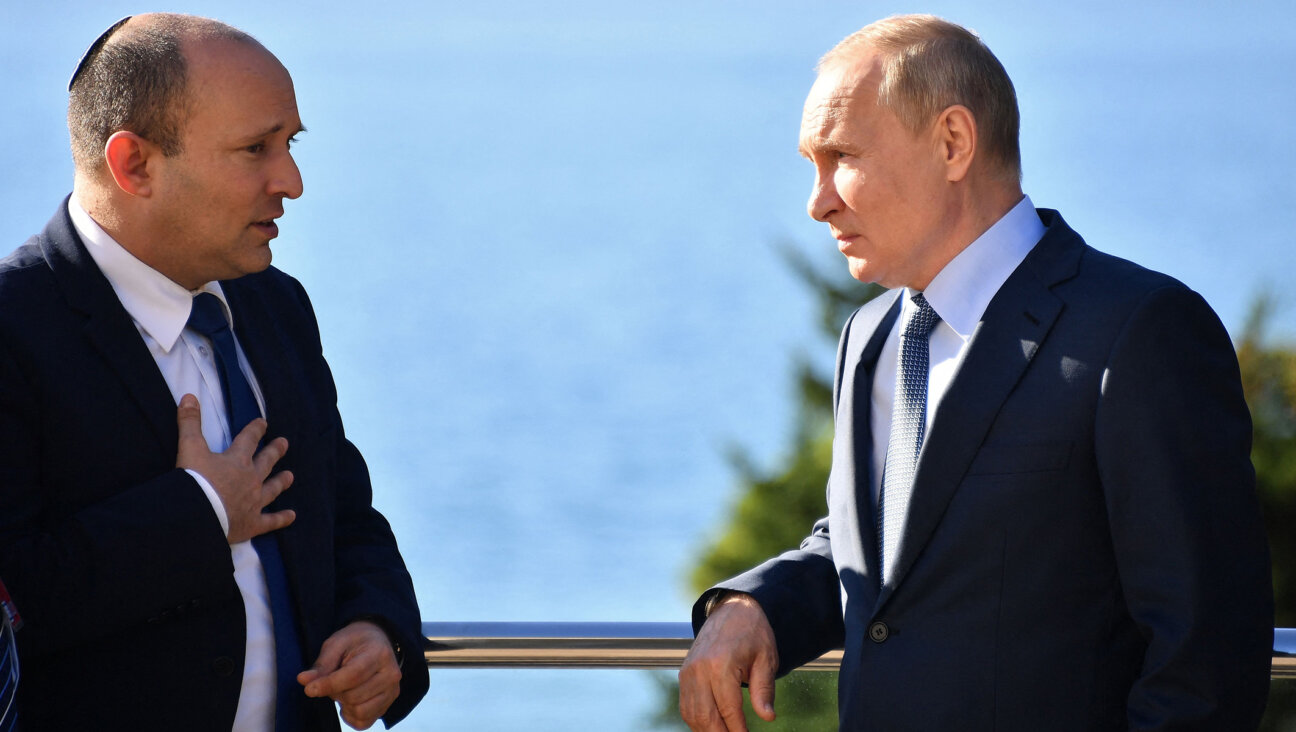 Russian President Vladimir Putin (R) speaks with Israeli Prime Minister Naftali Bennett during their meeting in Sochi, Russia, Oct. 22, 2021. (Yevgeny Biyatov/Sputnik/AFP via Getty Images)