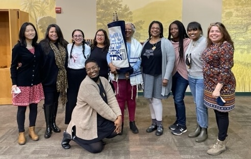 From left, participants in the JOC Mishpacha "We Are Family" JOCSM Shabbaton: Maetal Gerson, Avodah Jewish Service Corps Chicago, and Kol Or of JCUA; Denise Dautoff, Jewtina y Co.; Riki Robinson, Jews of Color Initiative; Ari Monts (kneeling); Mackenzie Martinez, Avodah Jewish Service Corps, San Diego; Sabrina Sojourner, co-founding director, KHAZBAR; Erica Riddick, Jews of Color Sanctuary; Deitra Reiser, founder, Transform for Equity; Kiyomi Kowalski, co-founder, Jewbian Princess; and Ramona Tenorio, Tiyuv Initiative.