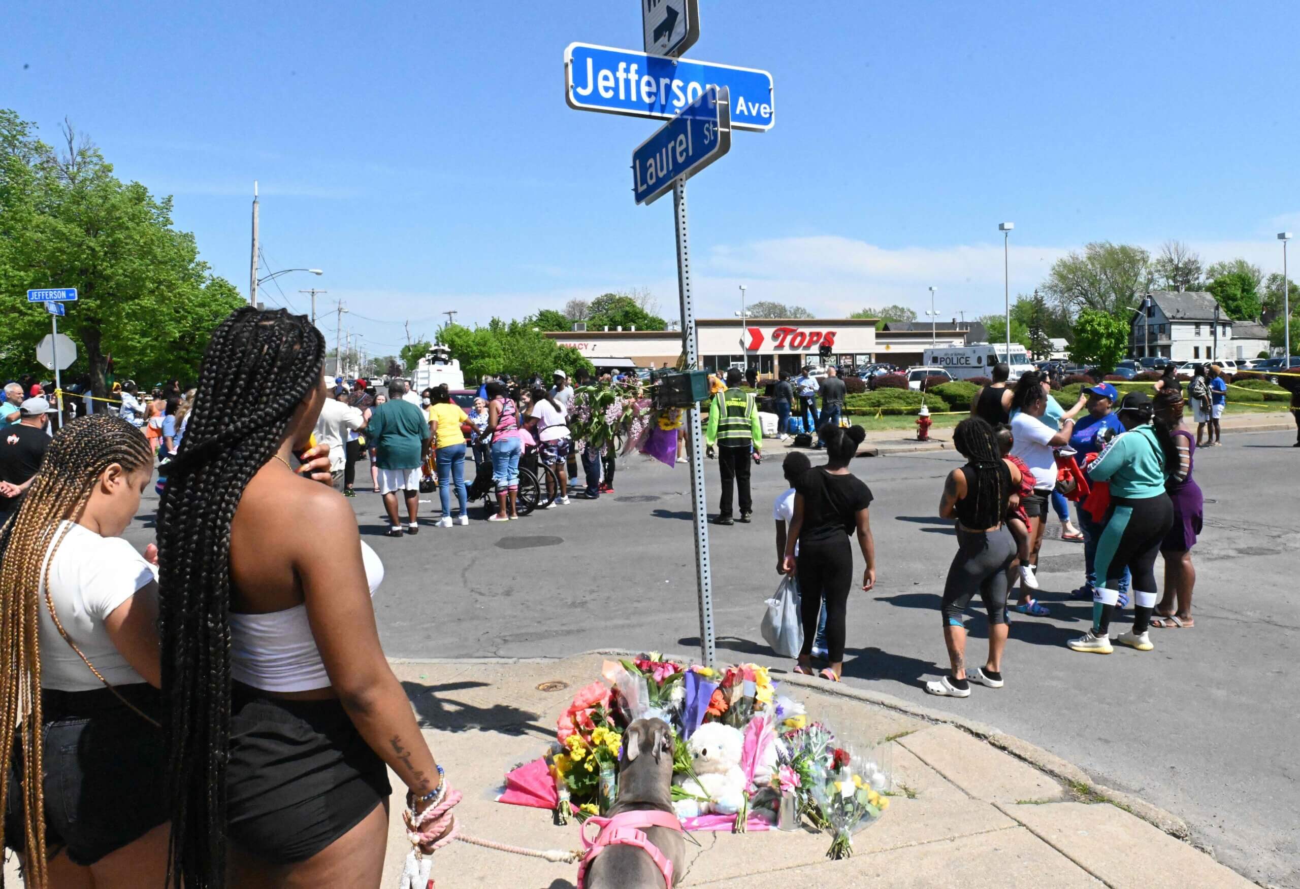 Community members participate in an August vigil near Buffalo's Tops Grocery store, the site of the mass shooting carried out by a white supremacist who targeted African-Americans, despite a manifesto that focused on his hatred of Jews.