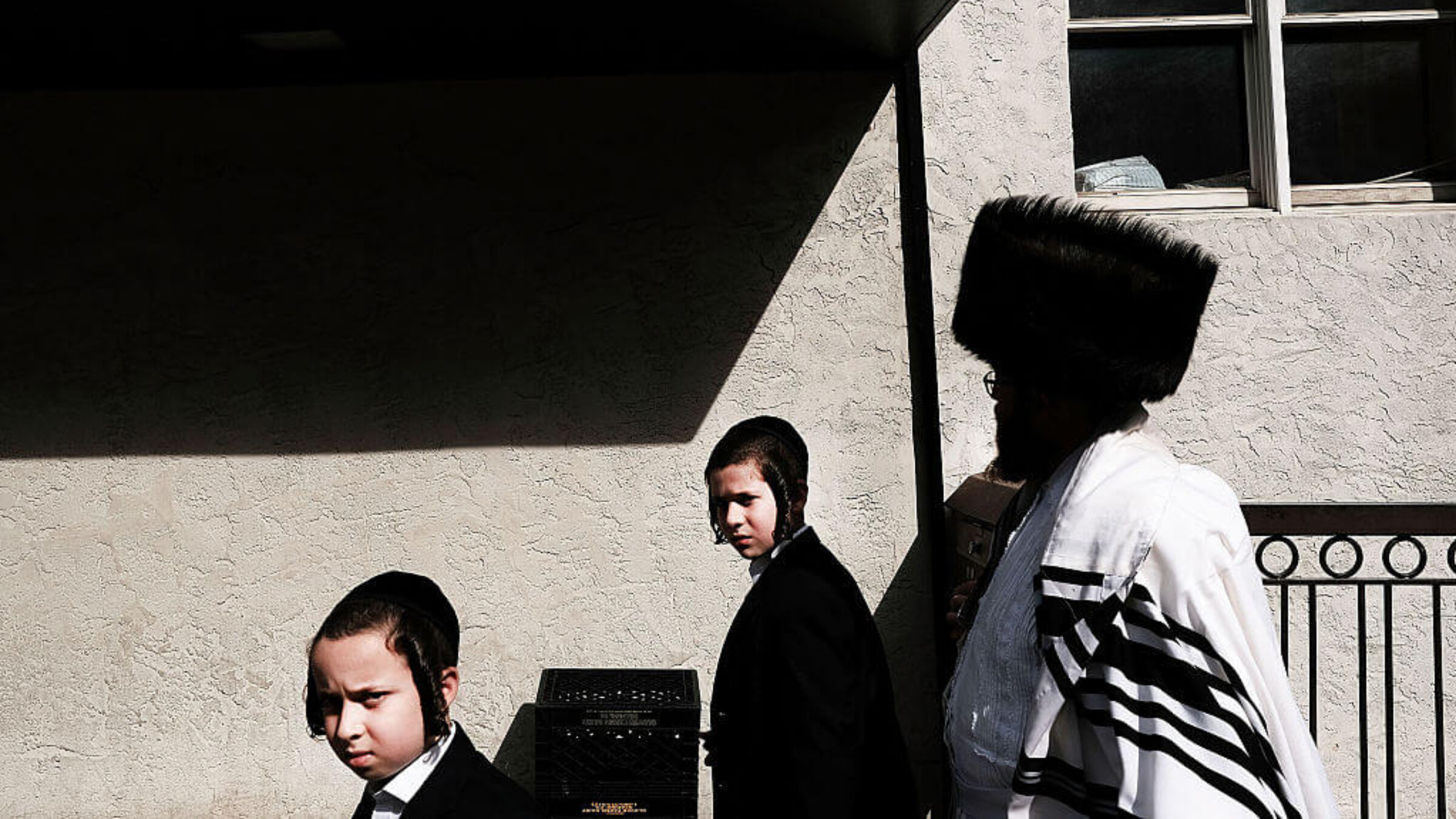 Members of an Orthodox Jewish community in Williamsburg, Brooklyn walk through the neighborhood on Yom Kippur, one of the most important holidays of the Jewish year on October 12, 2016 in New York City. 