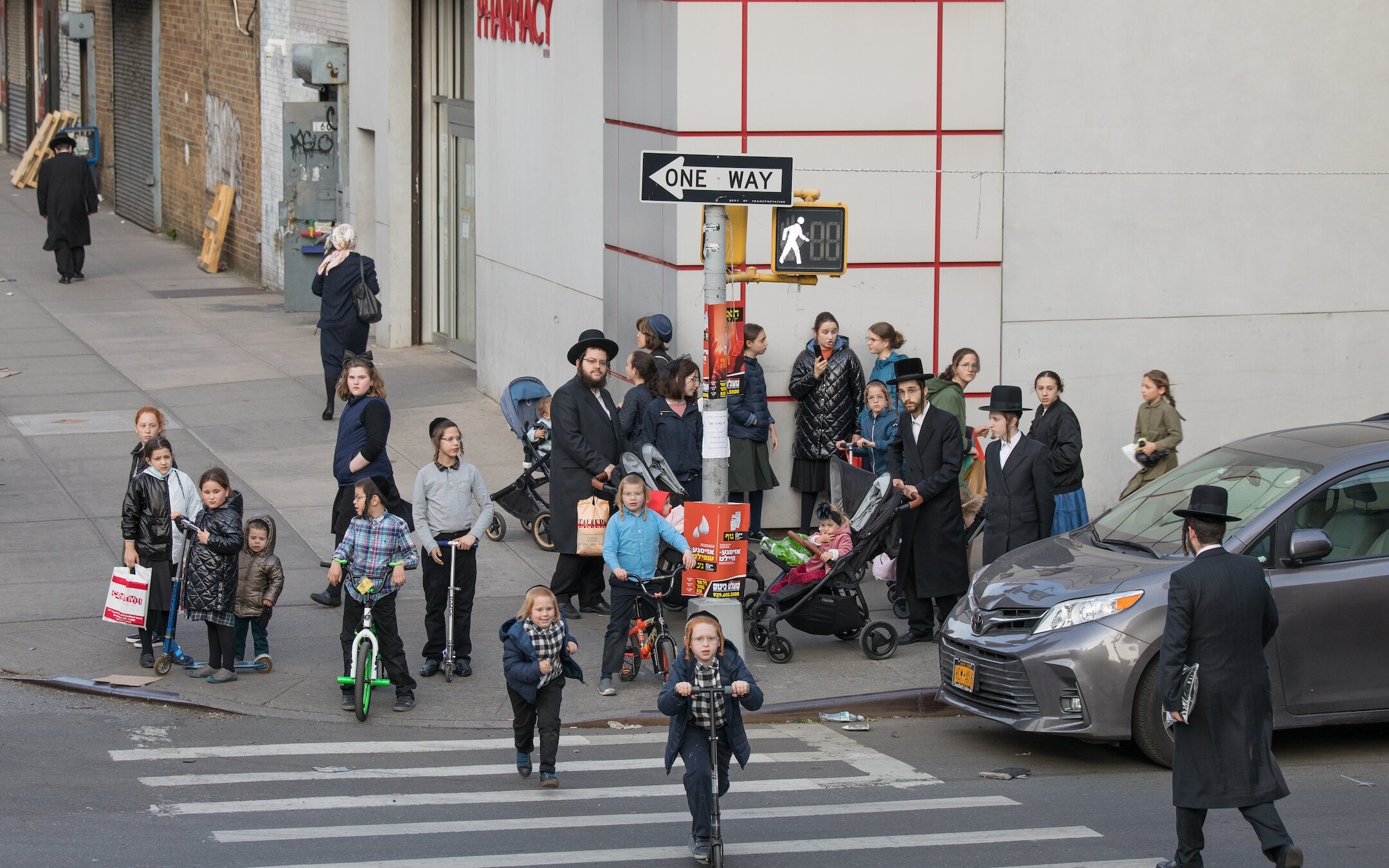 Families walk on the streets of Williamsburg May 12. (Avi Kaye)