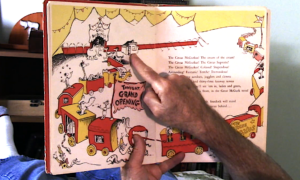 A man's hand points to a drawing in the children's book "If I Ran the Circus"