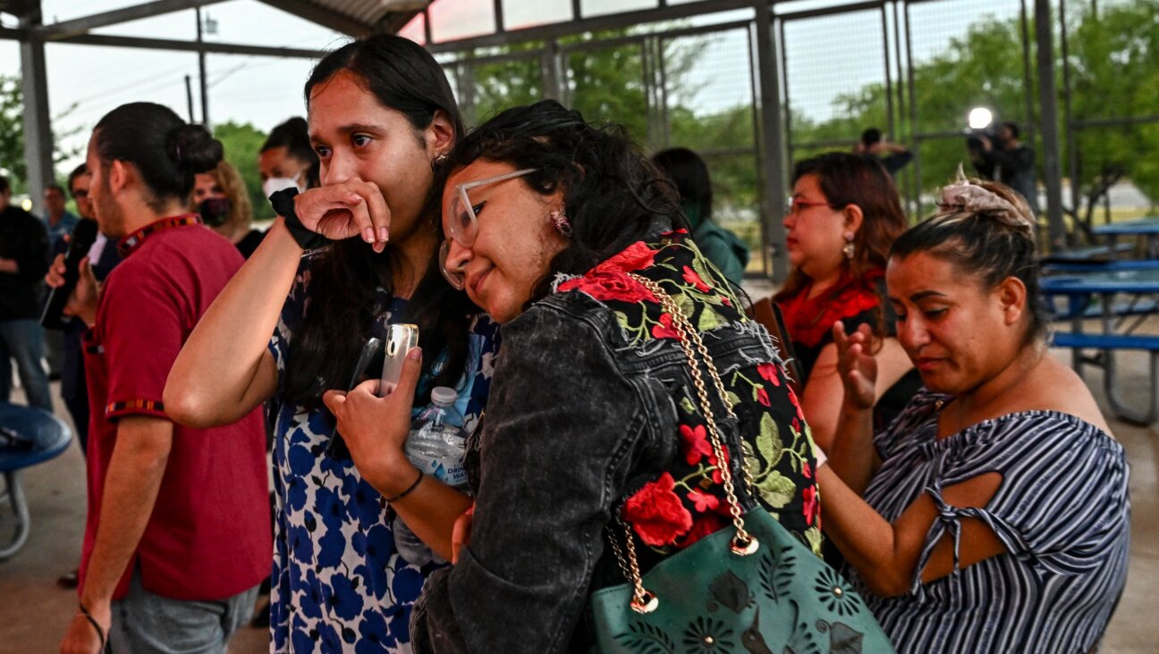 Residents of San Antonio attend a vigil for the 51 migrants found dead in an abandoned truck.