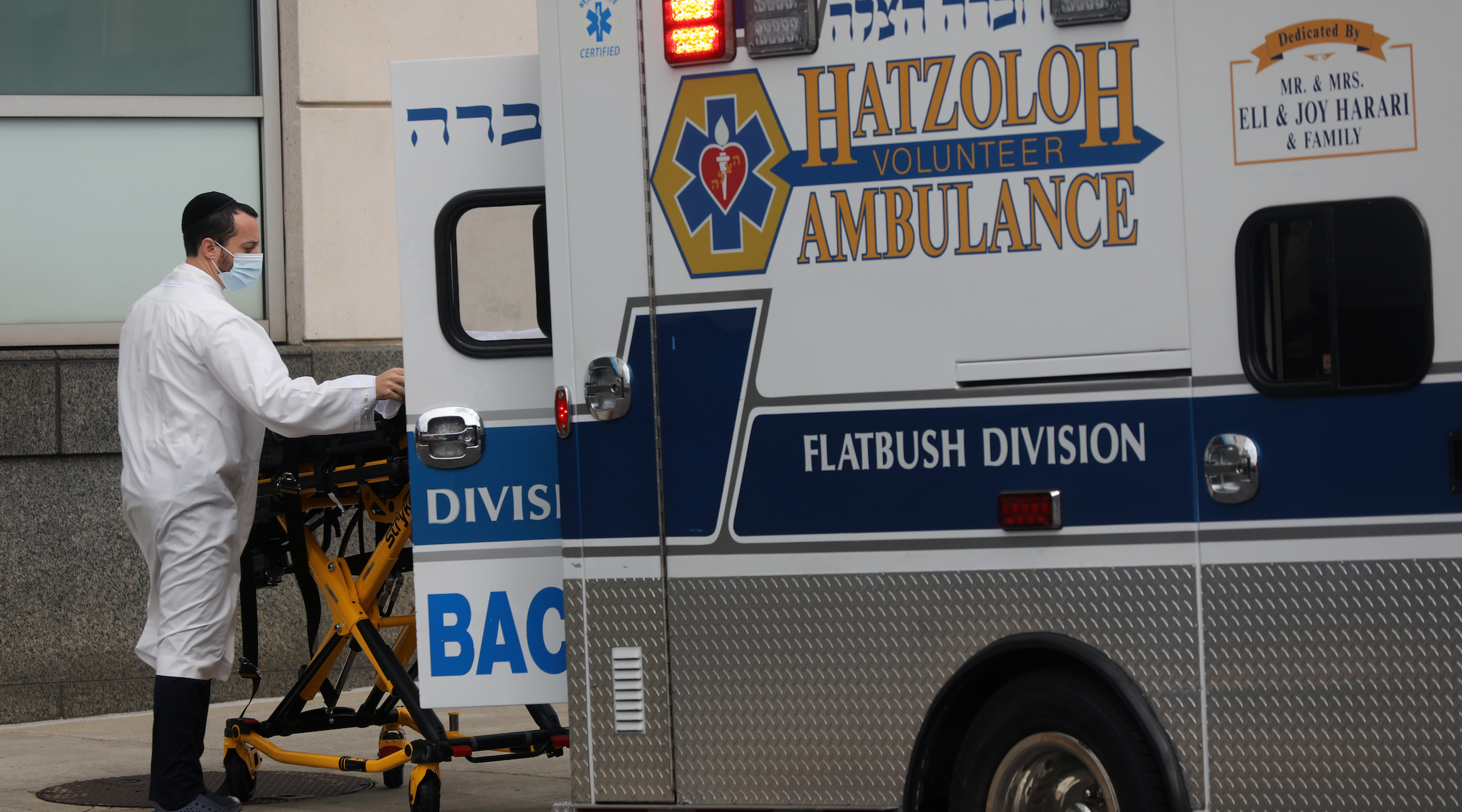 Hatzalah workers bring patients to Maimonides Medical Center in Borough Park, Brooklyn, in late 2020. (Spencer Platt/Getty Images)