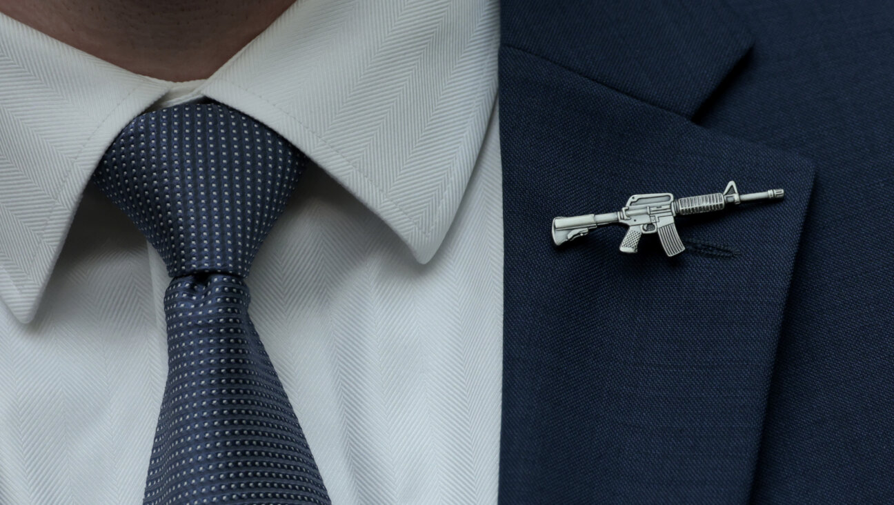 A congressional staffer wears a rifle-shaped pin on his suit during a House Judiciary Committee markup hearing in the Rayburn House Office Building on June 2, 2022, in Washington, D.C.