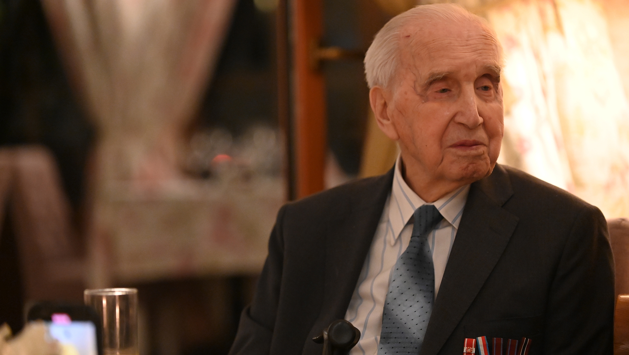 Jozef Walaszczyk, a 100-year-old who saved more than 50 Jews during the Holocaust, tells his story at a restaurant in Warsaw, Jan. 28, 2020. (Cnaan Liphshiz)