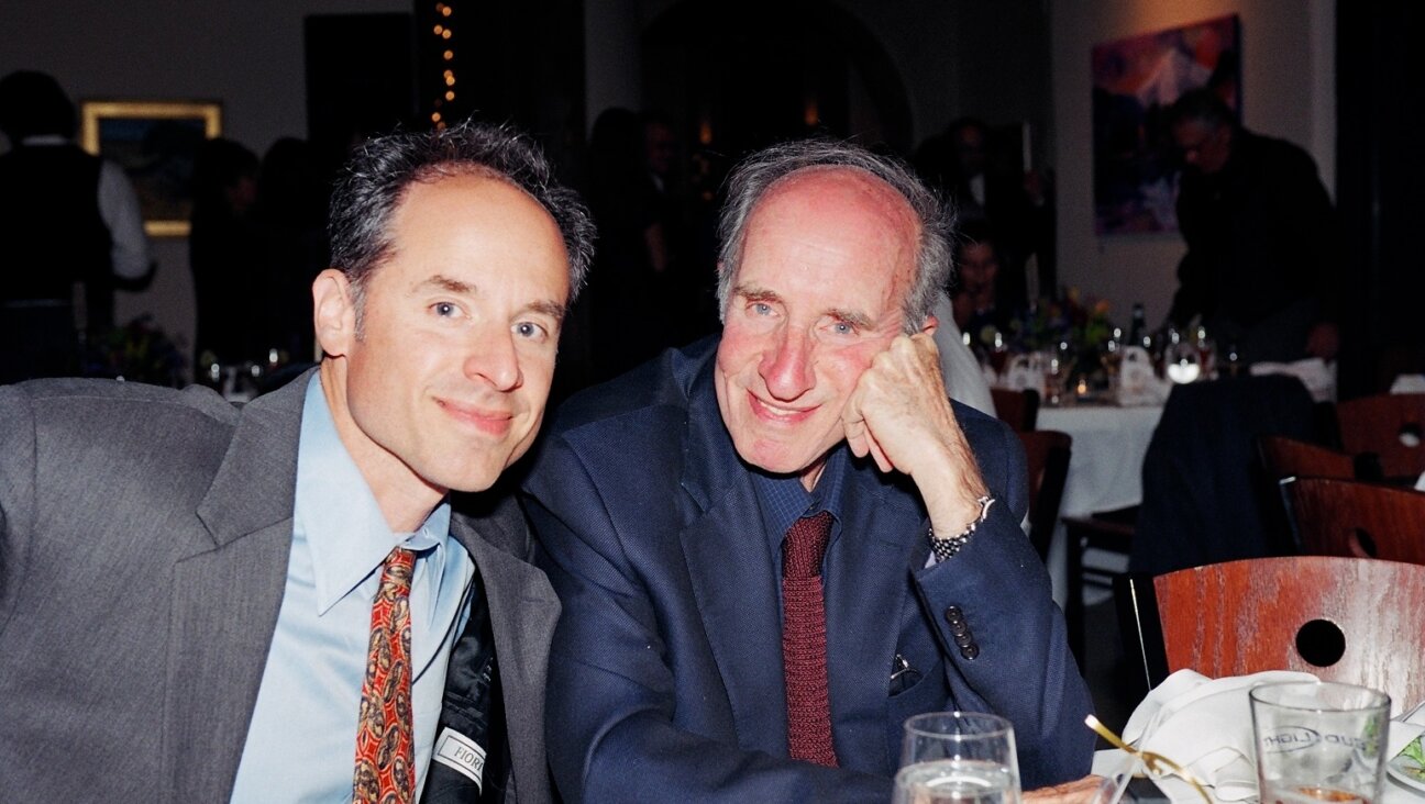 Stephen Straus, right, who was killed in the shooting, with his son Jon at a family wedding.