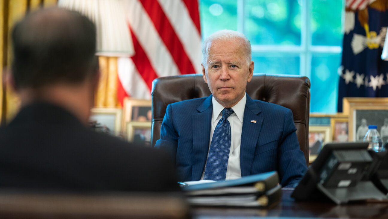 President Joe Biden meets with White House staff in the Oval Office, Thursday, Aug. 26, 2021, to prepare for a meeting with Israeli Prime Minister Naftali Bennett on August 26, 2021. 