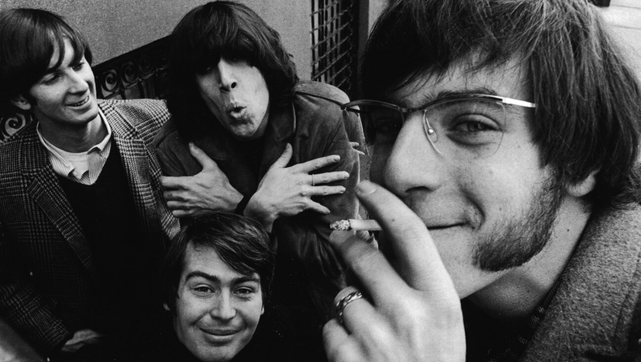  The Lovin' Spoonful pose on a street in the 1960s. Clockwise from bottom: drummer Joe Butler, bassist Steve Boone, co-founder and lead guitarist Zal Yanovsky and co-founder and singer John Sebastian. 