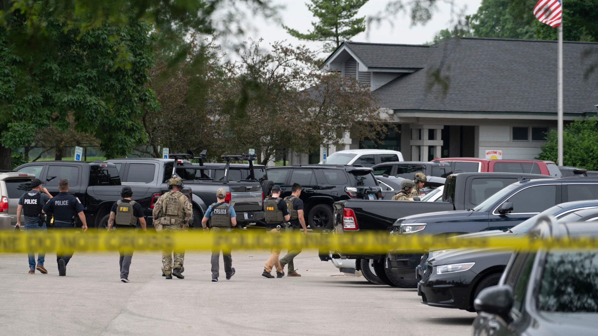 Law enforcement officers at the scene of a July 4 parade shooting in Highland Park, Illinois.