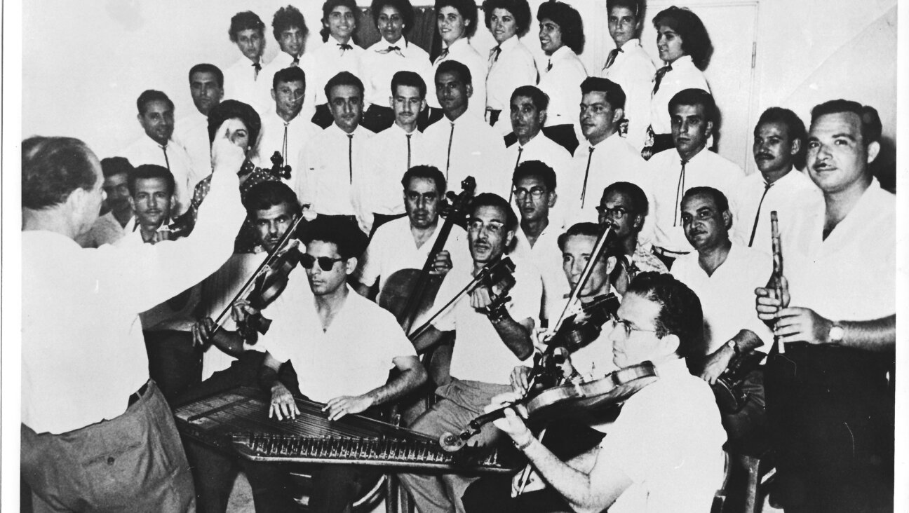 Avraham Salman (with dark glasses, center, bottom row) and the Israel Broadcasting Authority Orchestra rehearsing in the studio, circa 1959.