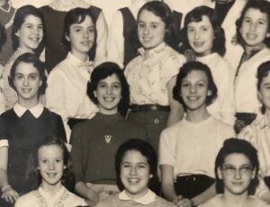 A group of girls posing for a yearbook photo