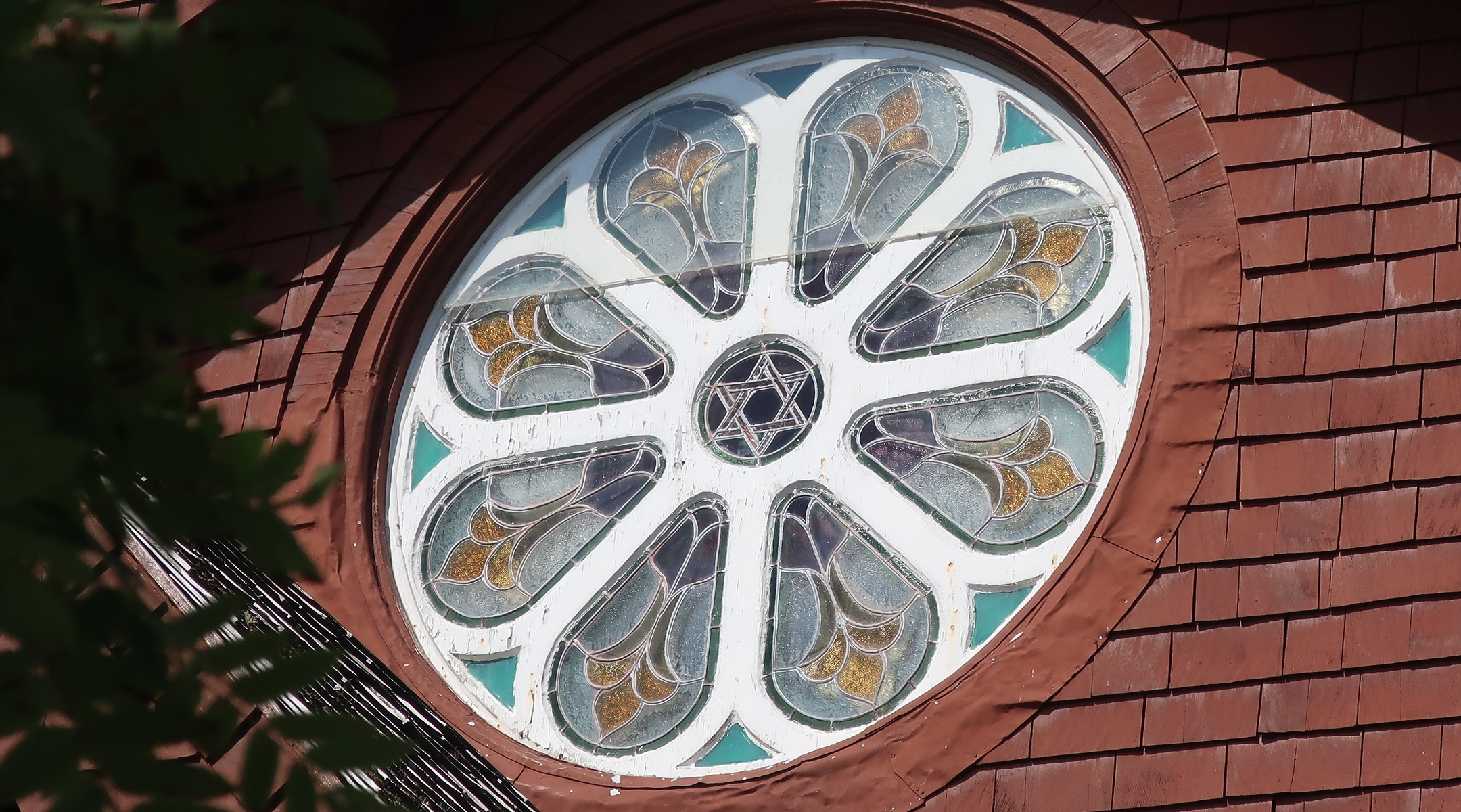 The stained-glass window at the front of the St. Peter’s by the Sea Espicopal church in downtown Sitka, Alaska, features a star of David in its center. (Dan Fellner)