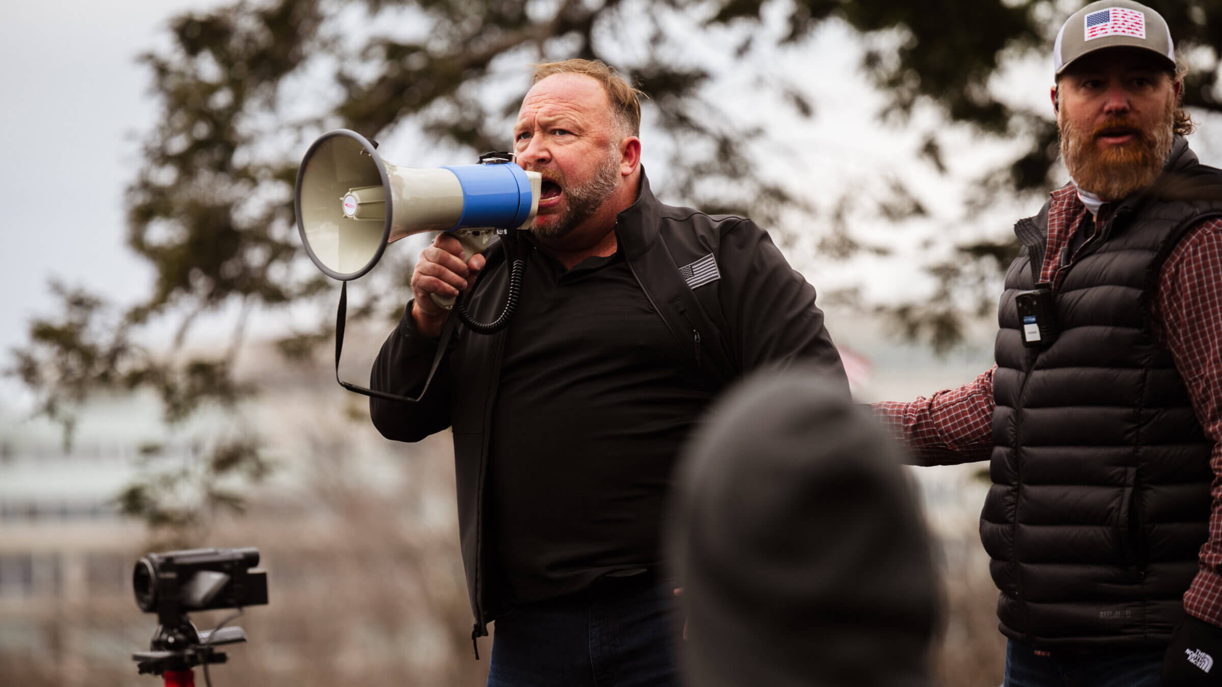 Alex Jones with a megaphone 