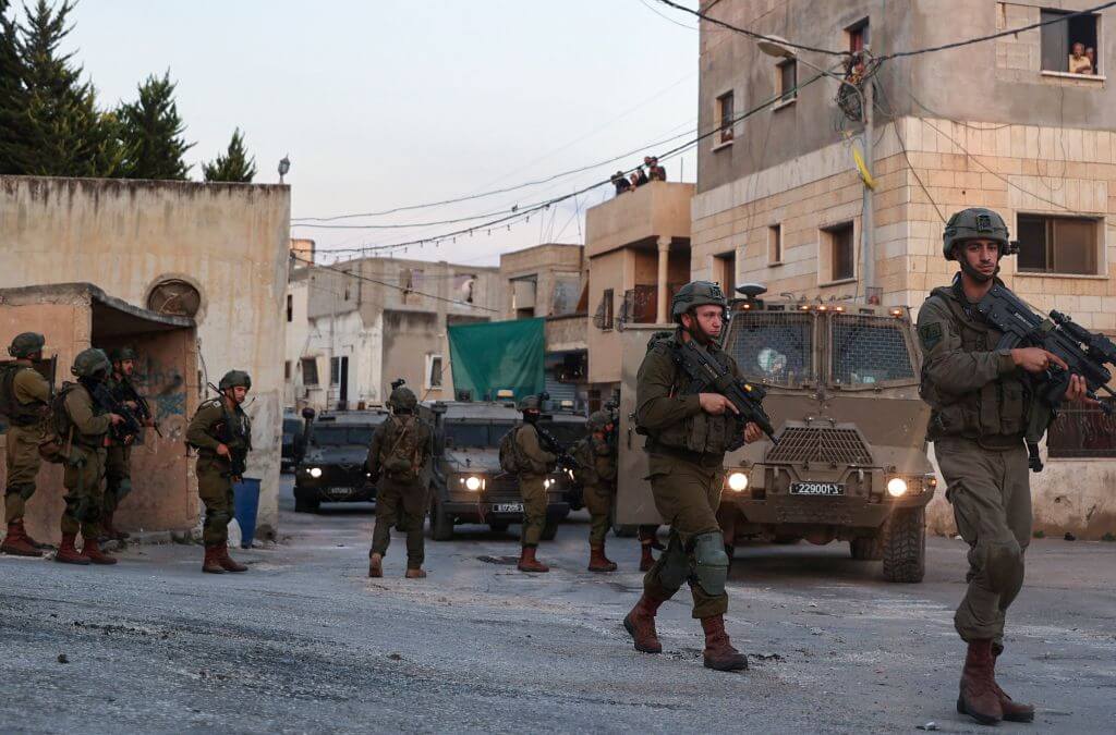 Members of the Israeli army deploy to demolish houses in in Rummanah town in the occupied West Bank, on August 8, 2022.