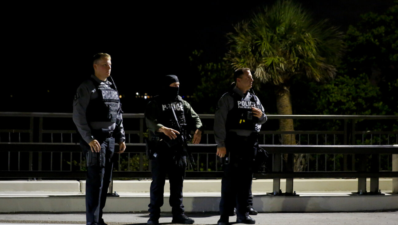 Palm Beach police officers keep watch near the home of former President Donald Trump at Mar-A-Lago on Aug. 8, 2022 ,in Palm Beach, Florida. The FBI raided the home to retrieve classified White House documents.