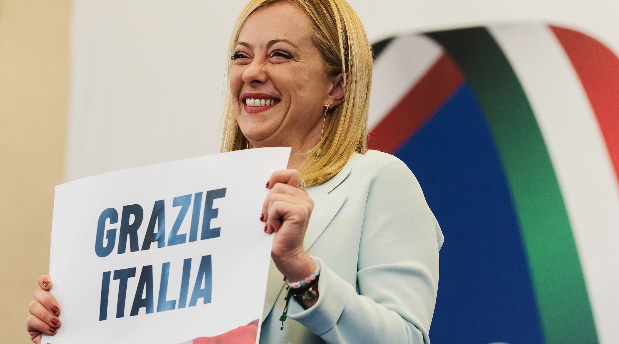 Giorgia Meloni is seen holding a placard quoting “Thanks Italy” in a press room in Rome, Sept. 26, 2022. (Valeria Ferraro/SOPA Images/LightRocket via Getty Images)