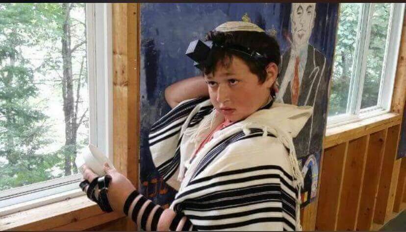 Asher wearing tefillin when he was 8. 