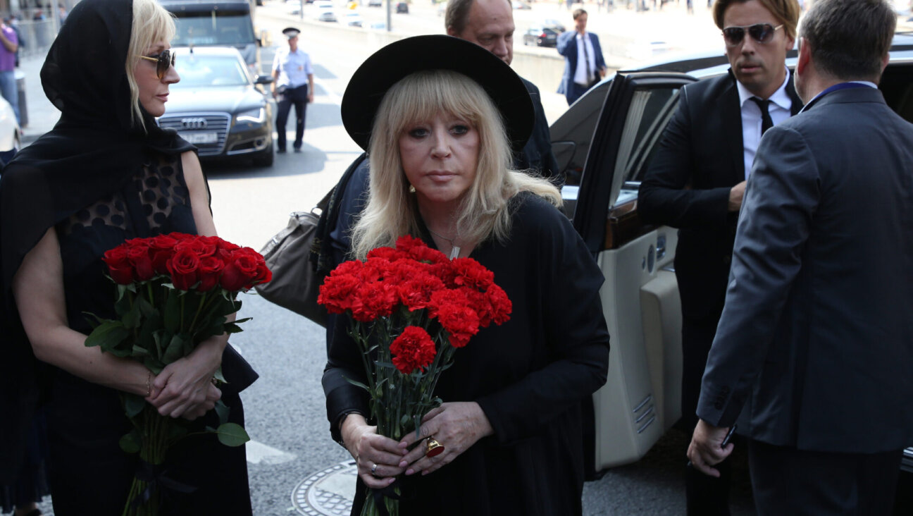 Russian pop star Alla Pugacheva and her husband Maksim Galkin, at right, arrive for the funeral of Russian singer and State Duma Deputy Joseph Kobzon in Moscow, Sept. 2, 2018.(Mikhail Svetlov/Getty Images)