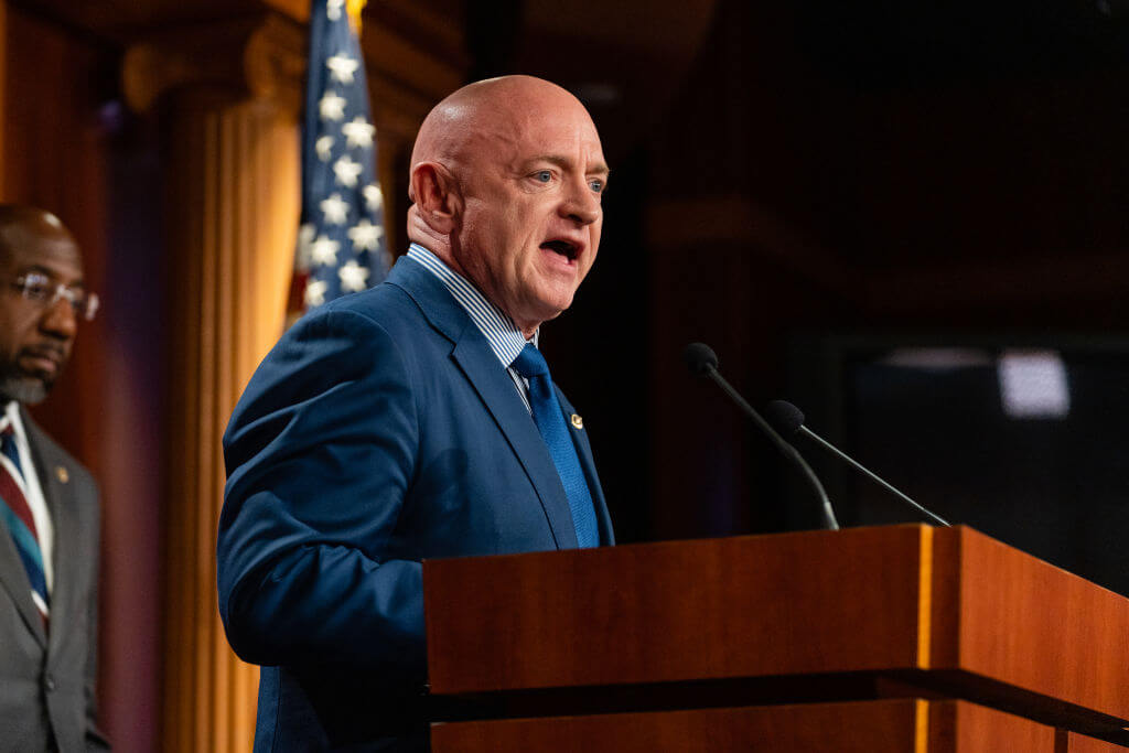 Democratic Senators Mark Kelly from Arizona and Raphael Warnock from Georgia at a news conference on July 26, 2022. 