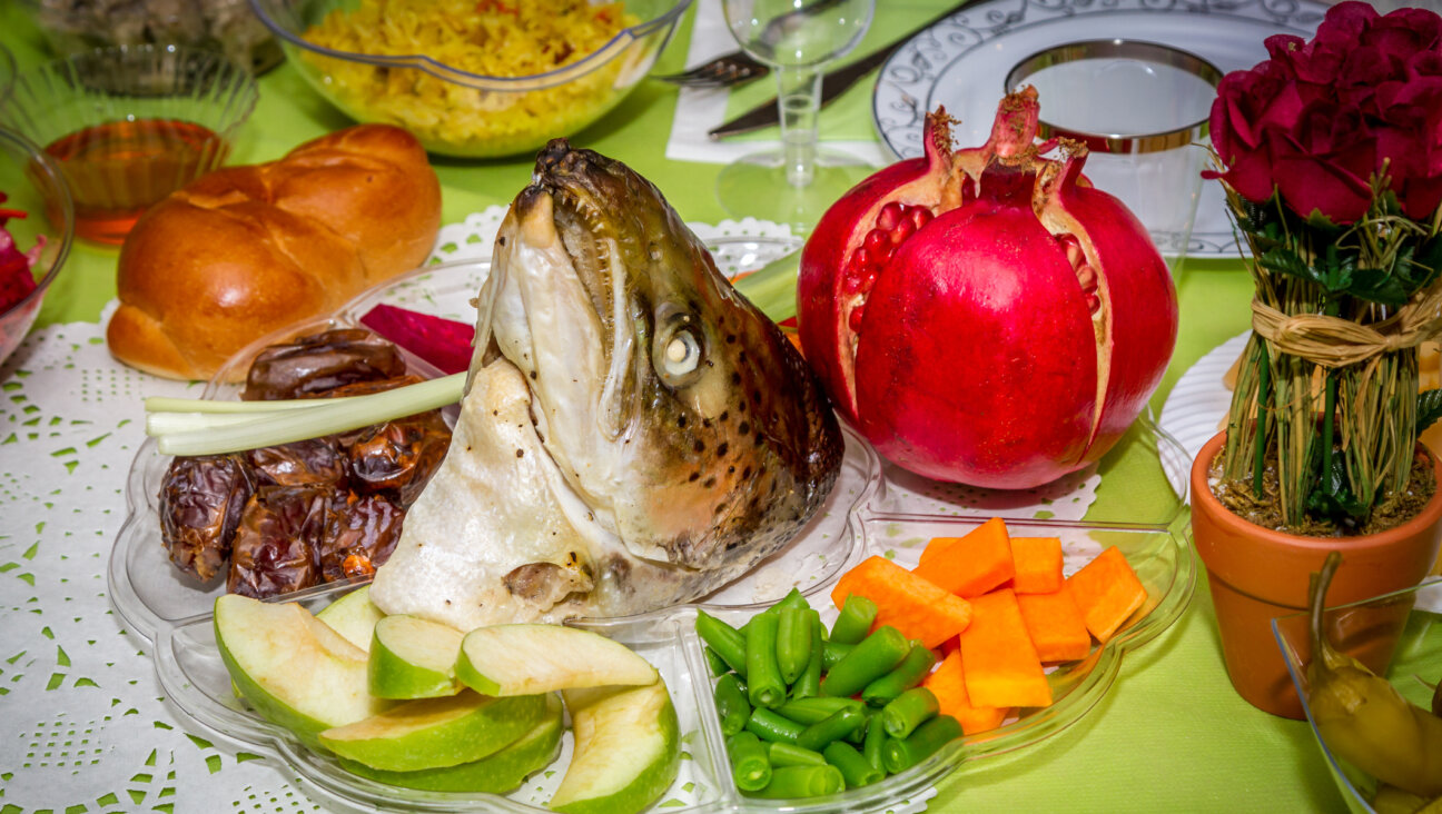 Doesn't the Rosh Hashanah seder look fun, fresh and appetizing? Just ignore the fish head glaring at you from the middle.