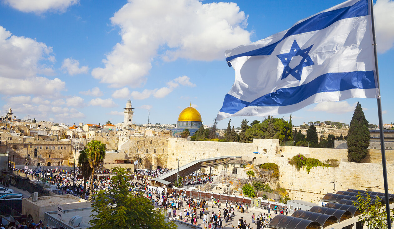 The Israeli flag overlooks the Western Wall plaza in Jerusalem.