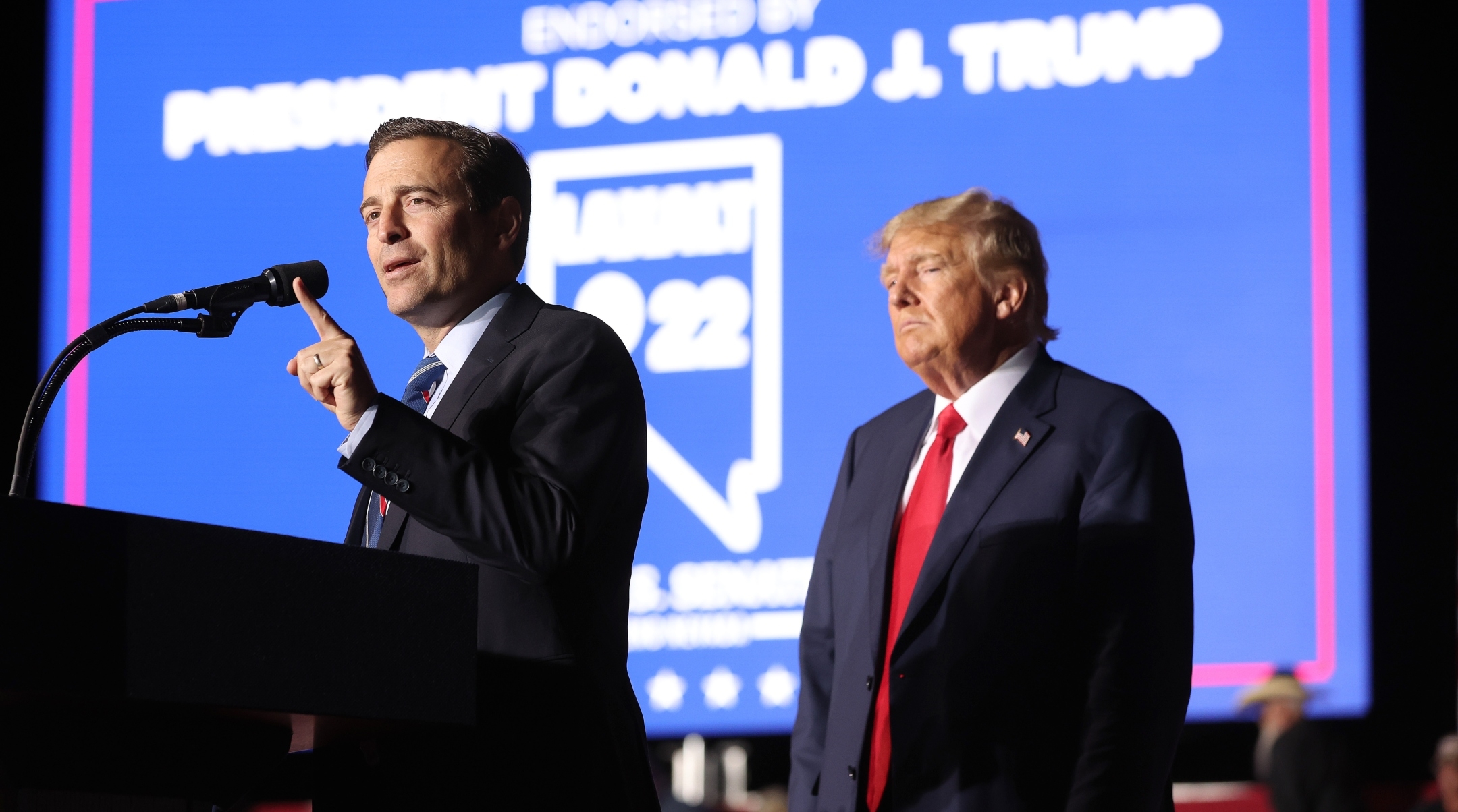 Nevada Republican U.S. Senate candidate Adam Laxalt joins former U.S. President Donald Trump on stage during a campaign rally at Minden-Tahoe Airport in Minden, Nevada, Oct. 08, 2022. (Justin Sullivan/Getty Images)