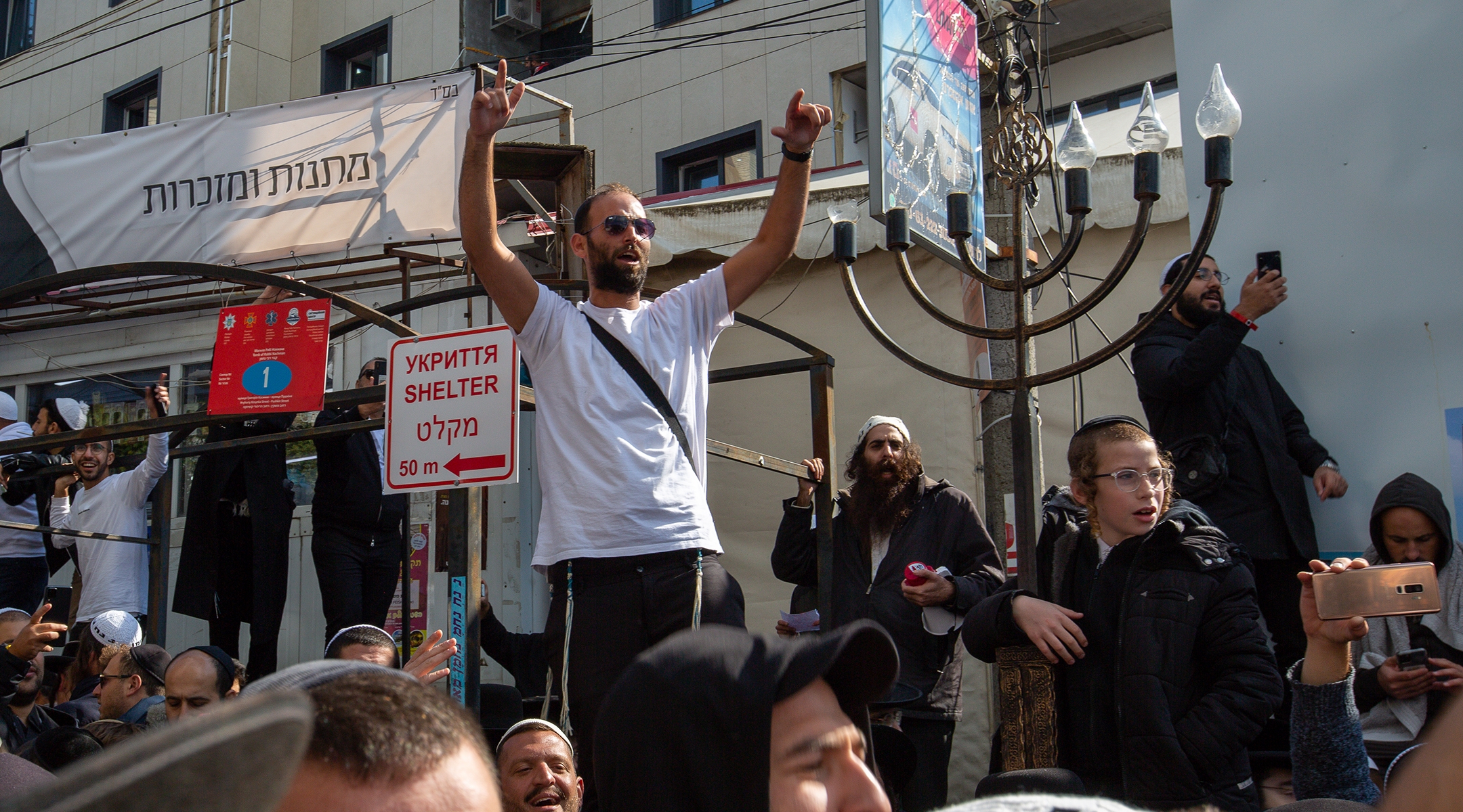 Men sing and dance at a celebration near the grave of Rabbi Nachman of Breslov in Uman, Ukraine, Sept. 25, 2022. (David Saveliev)