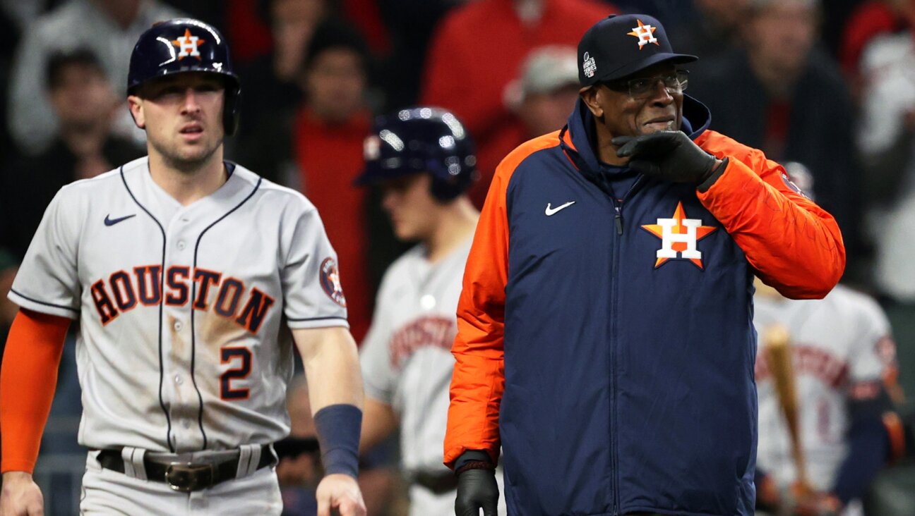 Alex Bregman shown with his manager Dusty Baker during a game against the Philadelphia Phillies at Minute Maid Park in Houston, Oct. 5, 2022. (Tim Warner/Getty Images)