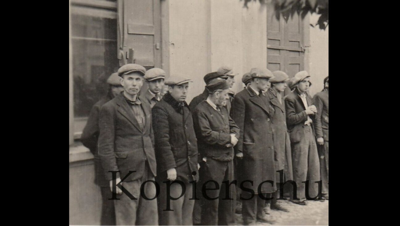 This 1939 photo of Jews lined up by the Nazis in Nasielsk, Poland, turned up for sale on eBay.