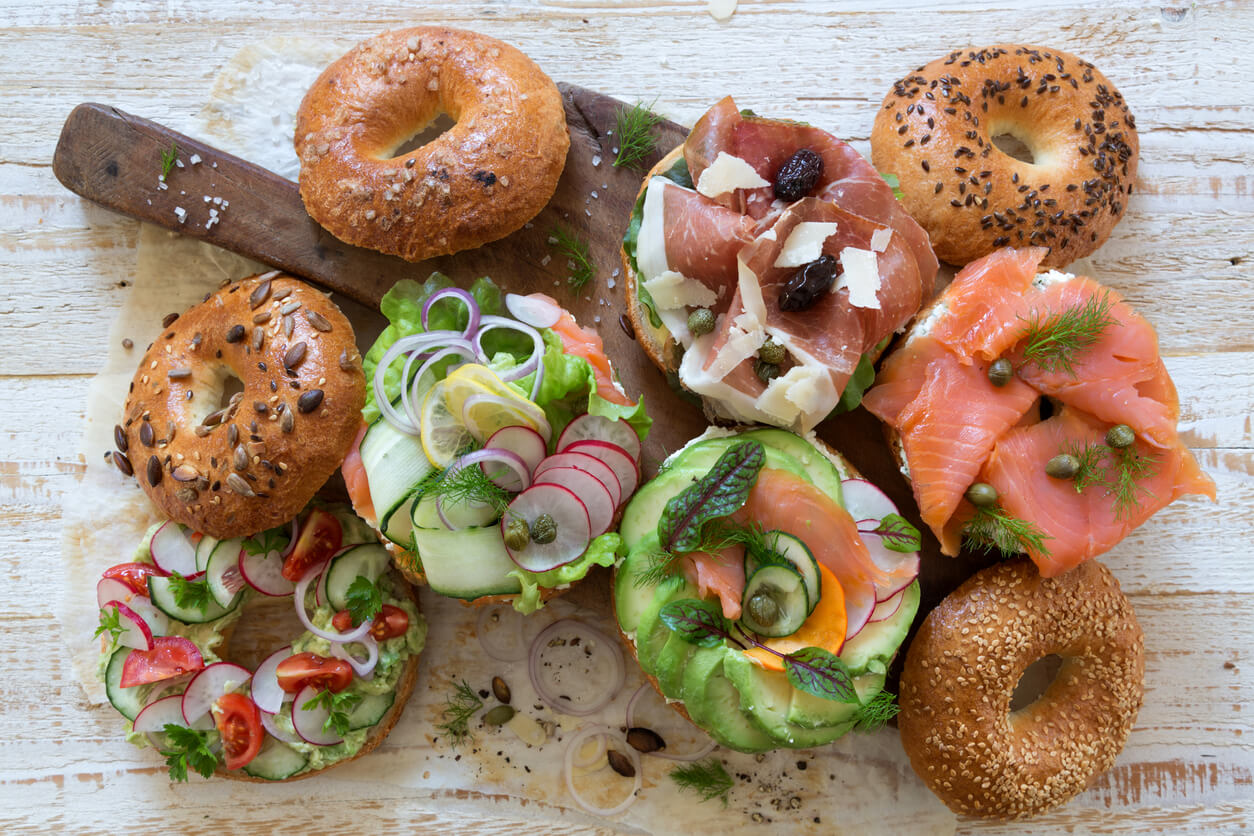 Bagel sandwiches on cutting board.