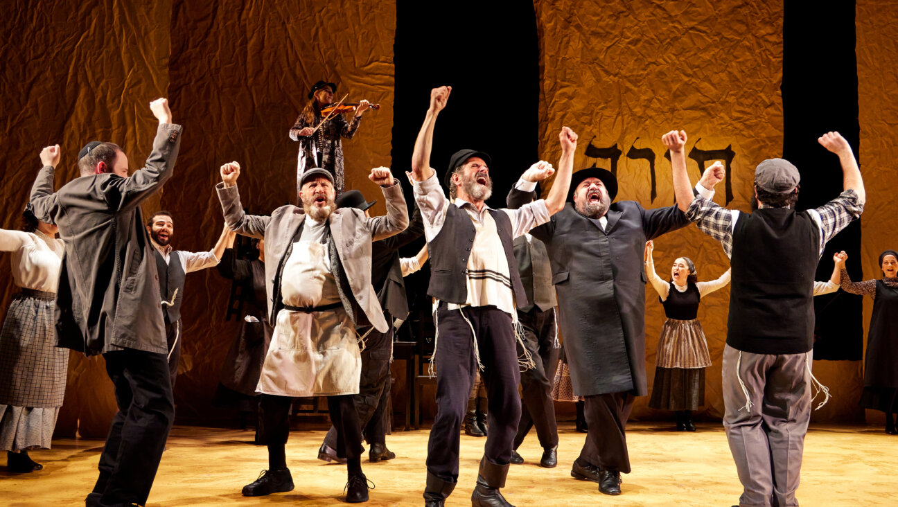 Bruce Sabath (Leyzer-Volf), Steven Skybell (Tevye), Adam B. Shapiro (Der Rov) and company in "Fidler Afn Dakh."