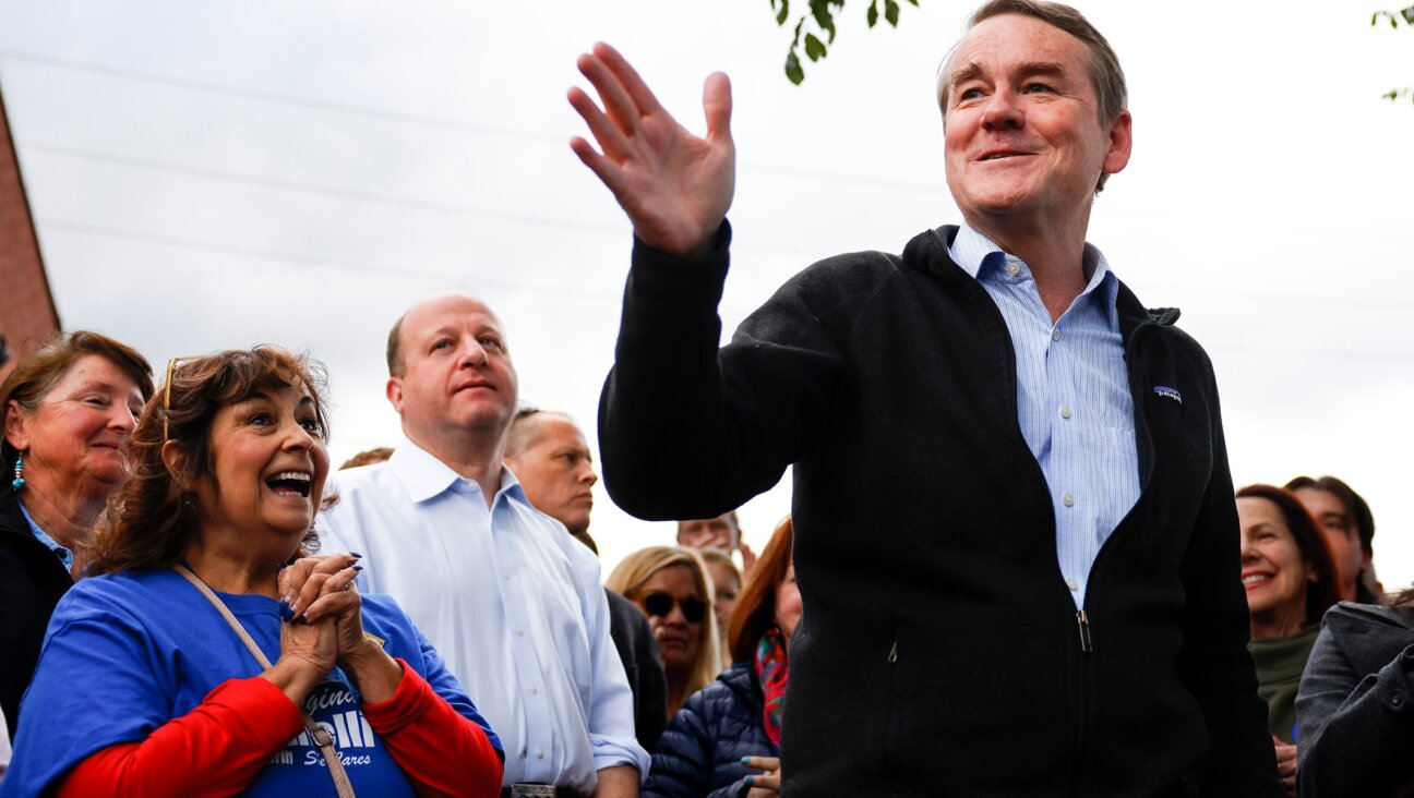 Michael Bennet speaks to supporters at a rally outside Mountain Toad Brewing in Golden, Colo., Oct. 26, 2022. (Michael Ciaglo/Getty Images)