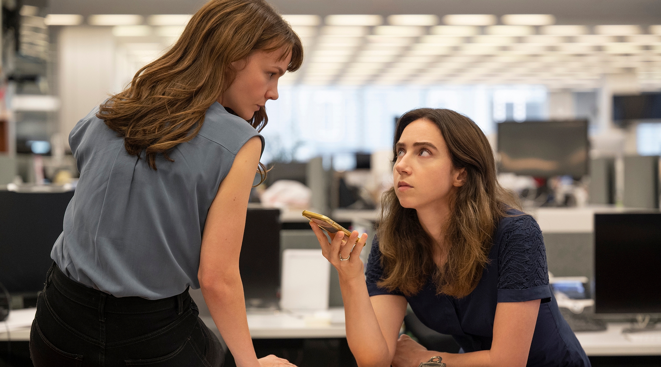 Carey Mulligan, left, as Megan Twohey and Zoe Kazan as Jodi Kantor in “She Said.” (JoJo Whilden/Universal Pictures)