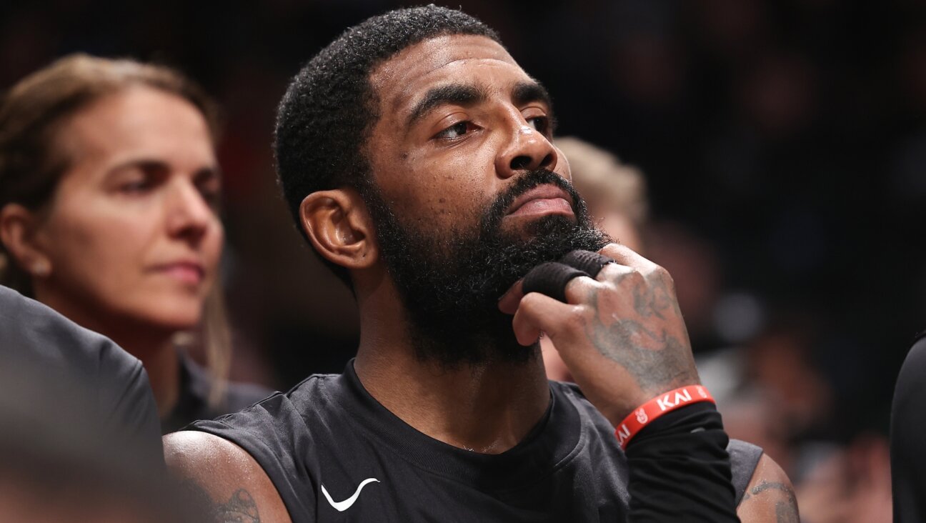 Kyrie Irving looks on from the bench during a game against the Indiana Pacers at the Barclays Center in Brooklyn, Oct. 31, 2022 (Dustin Satloff/Getty Images)