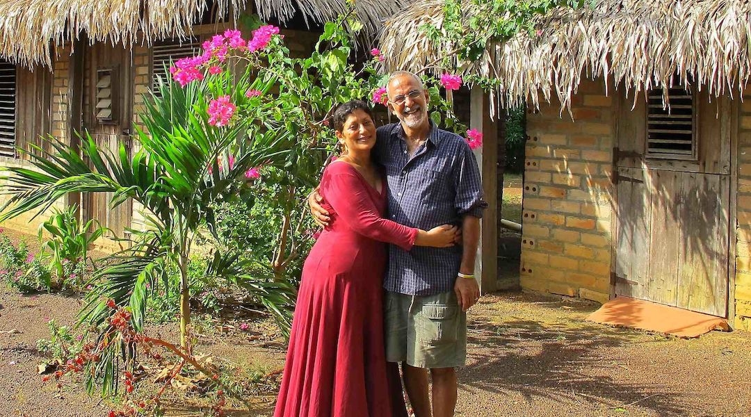 Andrea de Caires, left, shown with her husband Salvador, is one of two known Jews in the English-speaking nation. (Courtesy of de Caires)