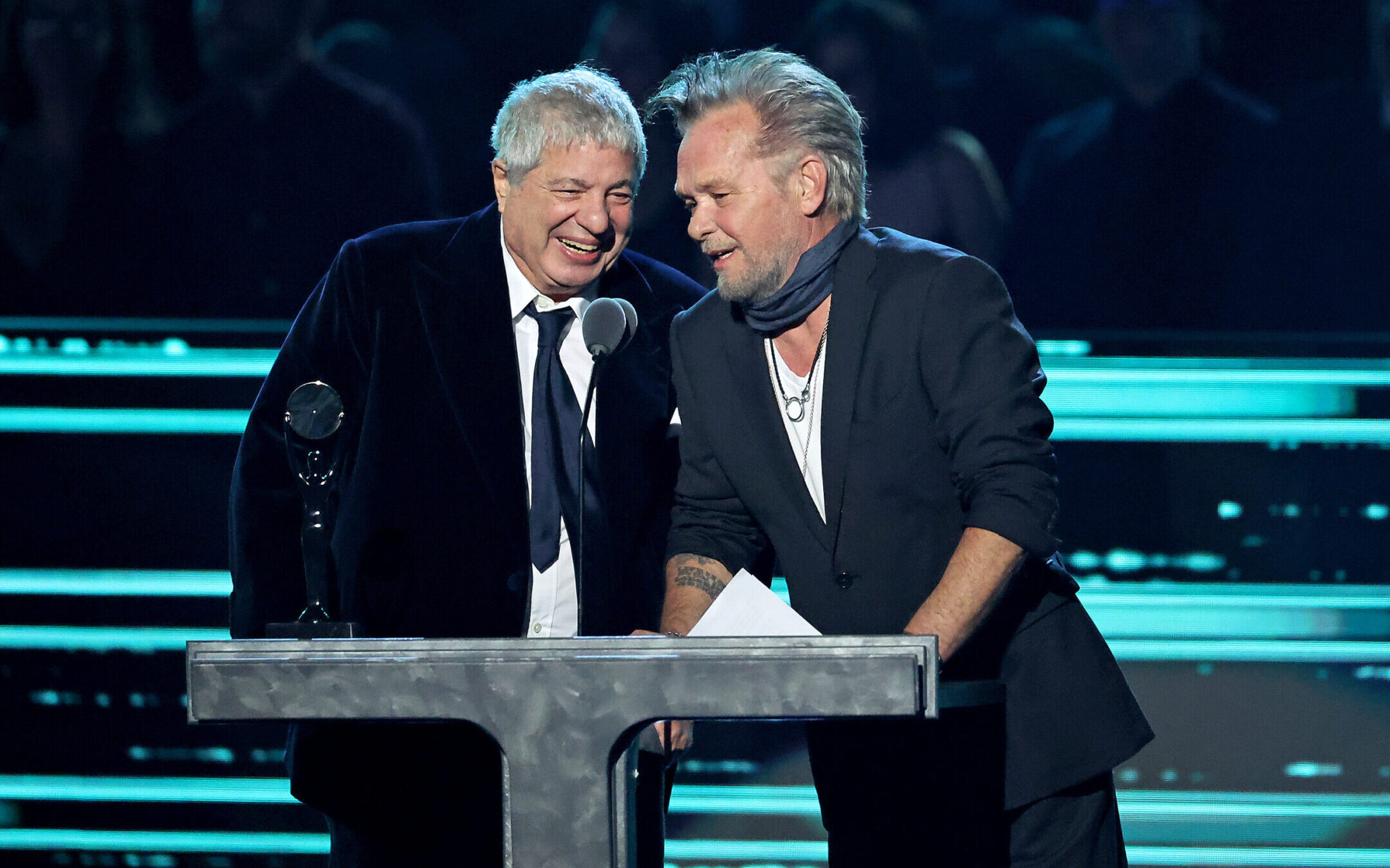 Attorney Allen Grubman, left, and rocker John Mellencamp speak onstage during the 37th Annual Rock & Roll Hall of Fame Induction Ceremony in Los Angeles, Nov. 5, 2022. (Amy Sussman/WireImage)