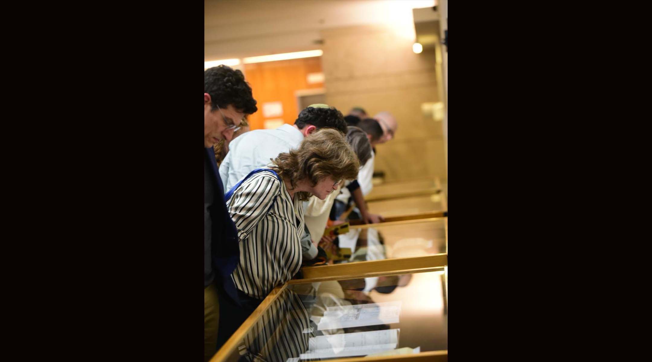 Members and descendants of Israel’s Irish-Jewish community viewing items from the genealogical history of the Jewish communities of Ireland at a ceremony in Jerusalem, Dec. 19, 2022. (Yoni Kelberman)