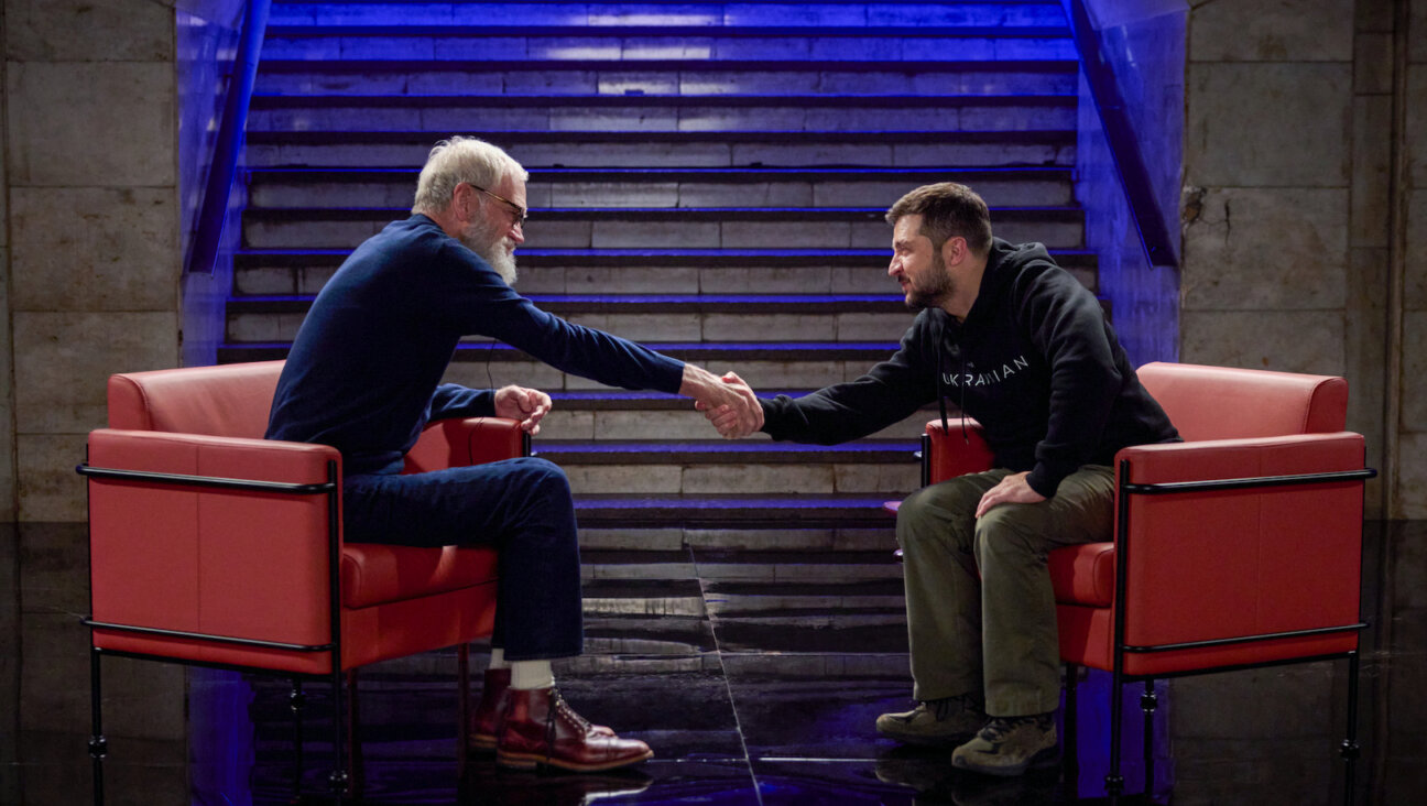 David Letterman and Volodymyr Zelenskyy, two comics who've come into gravitas, shake hands.